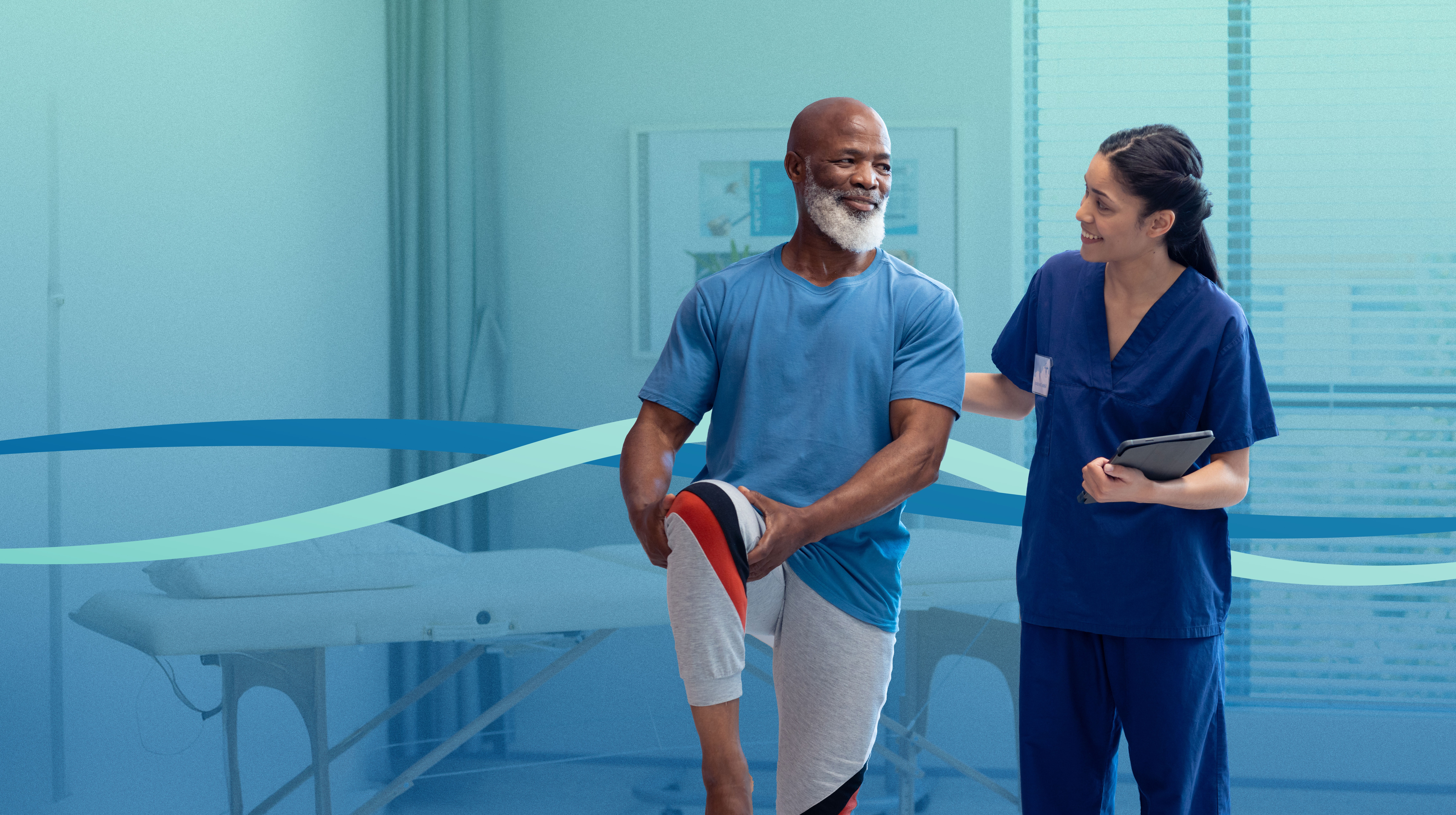 Physical therapist helping patient during physical therapy session Physical therapist helping patient during physical therapy session